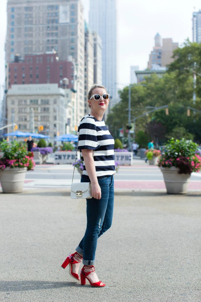 Meghan Donovan of wit & whimsy wears a striped tee with boyfriend jeans