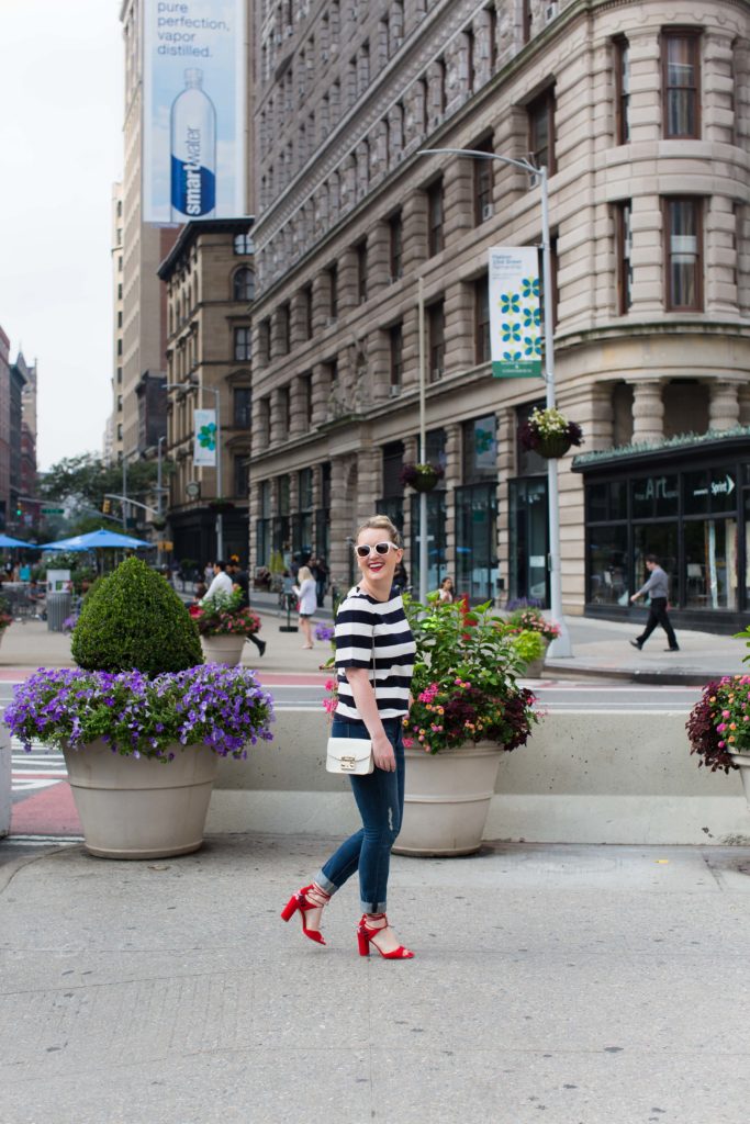 Meghan Donovan of wit & whimsy wears a striped tee with boyfriend jeans