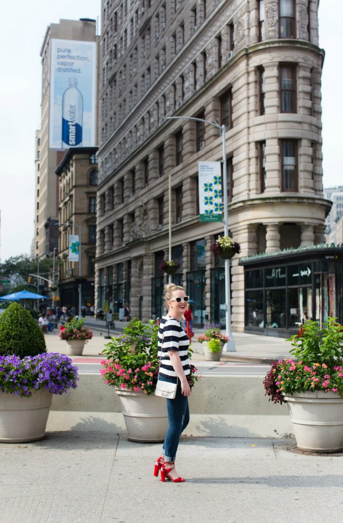 Meghan Donovan of wit & whimsy wears a striped tee with boyfriend jeans
