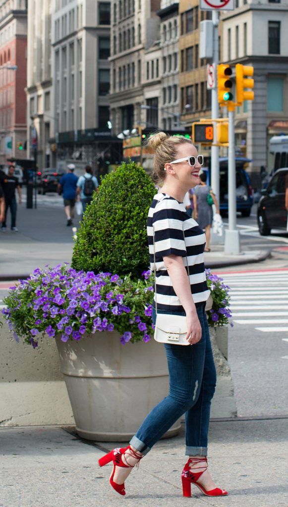Meghan Donovan of wit & whimsy wears a striped tee with boyfriend jeans