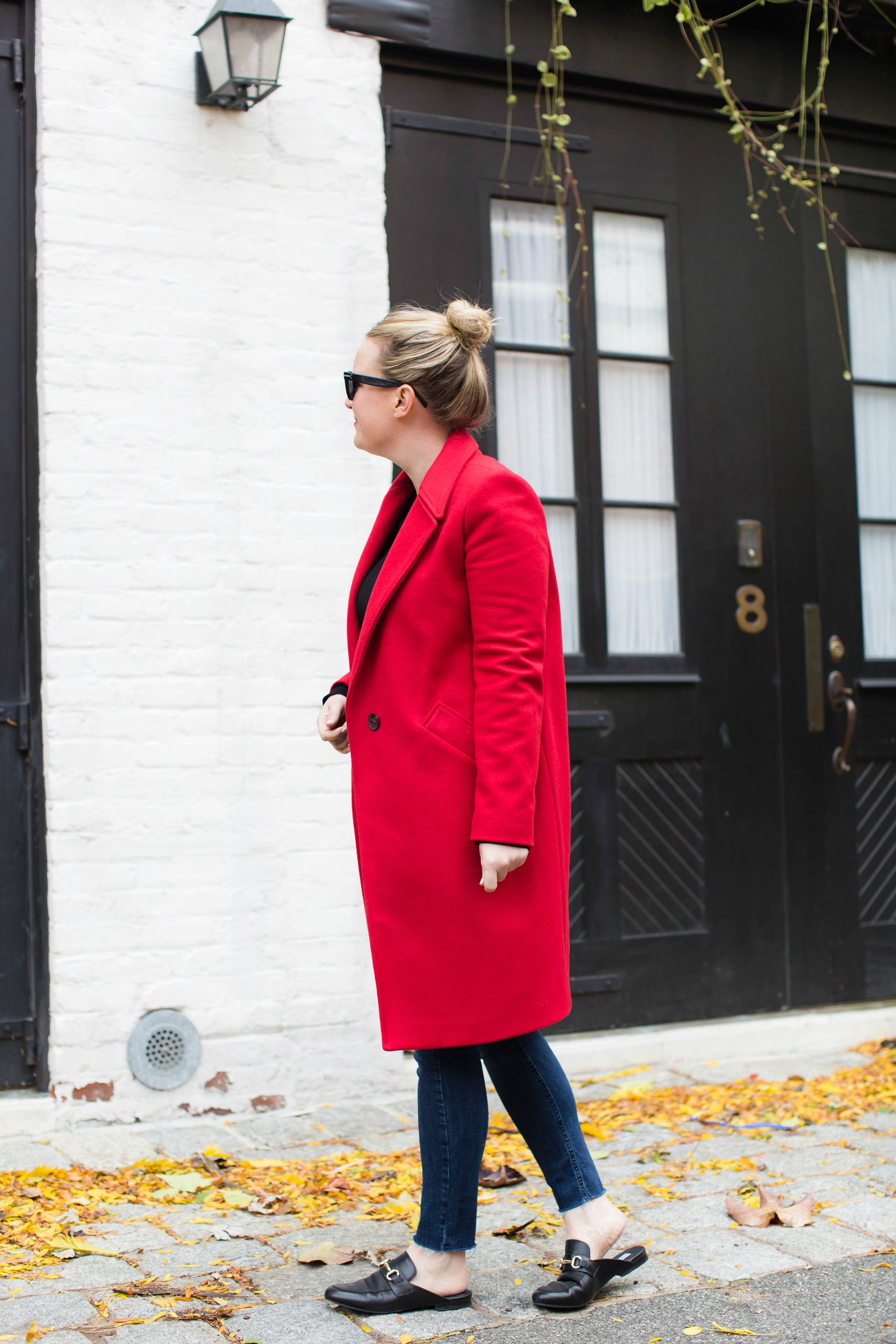 Meghan Donovan styles a red coat