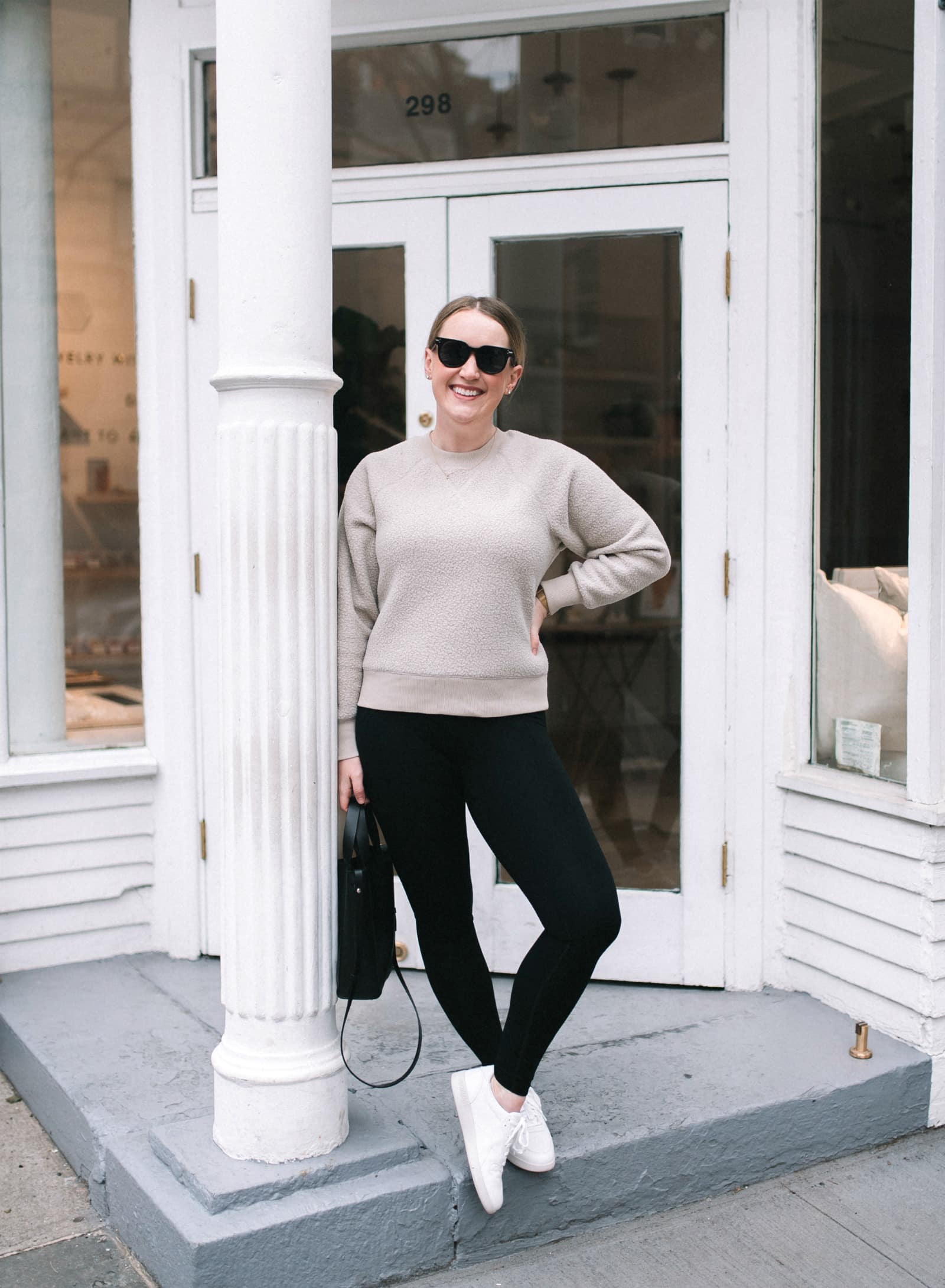 a sporty sweatshirt paired with leggings and a good sneaker