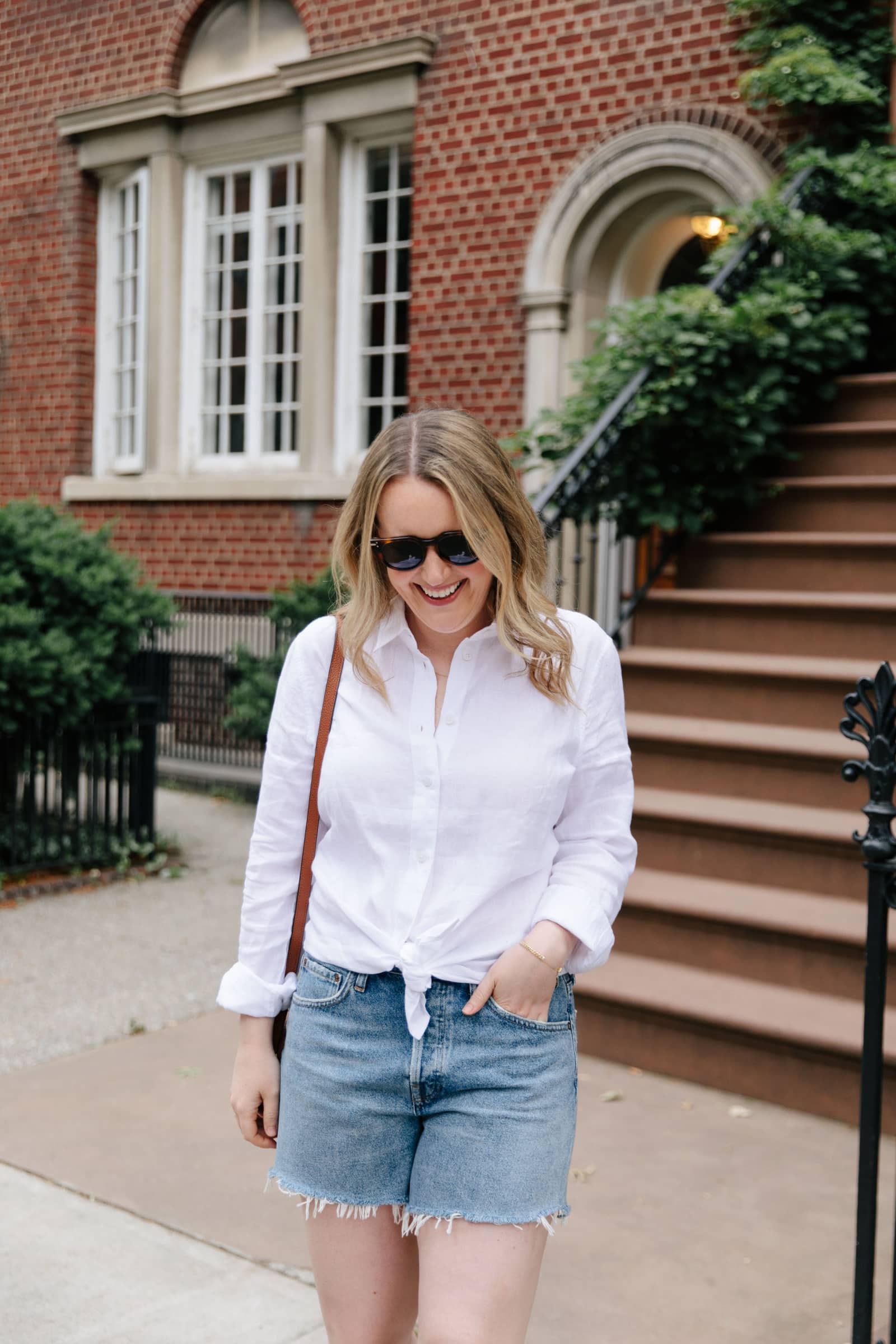 J Crew & Madewell Summer Favorites by Wit Whimsy - woman wearing Irish Linen Button Down and denim shorts