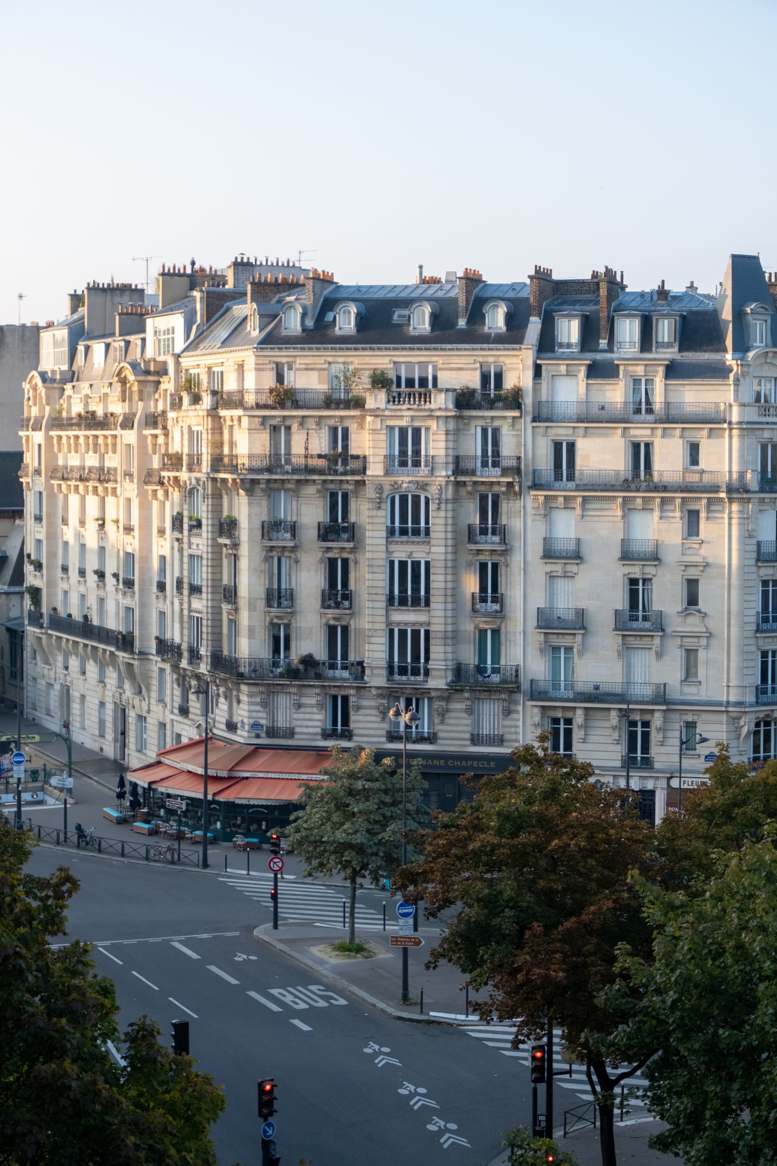Paris in October A building in Paris in the Fall along a quiet road.