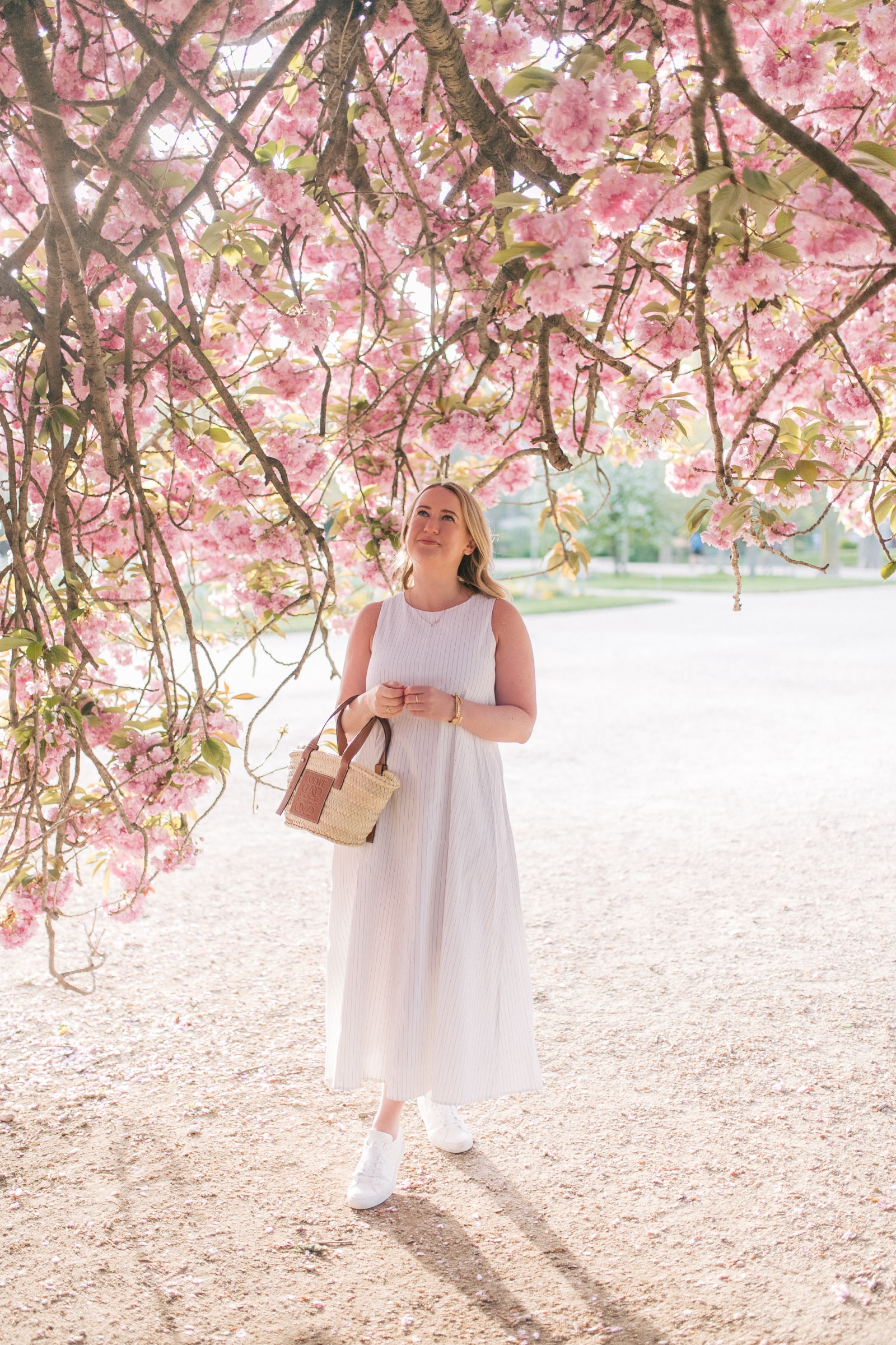 How to Dress for Paris in the Summer MM.LaFleur Cotton Dress with Loewe Straw Tote and Common Projects Sneakers