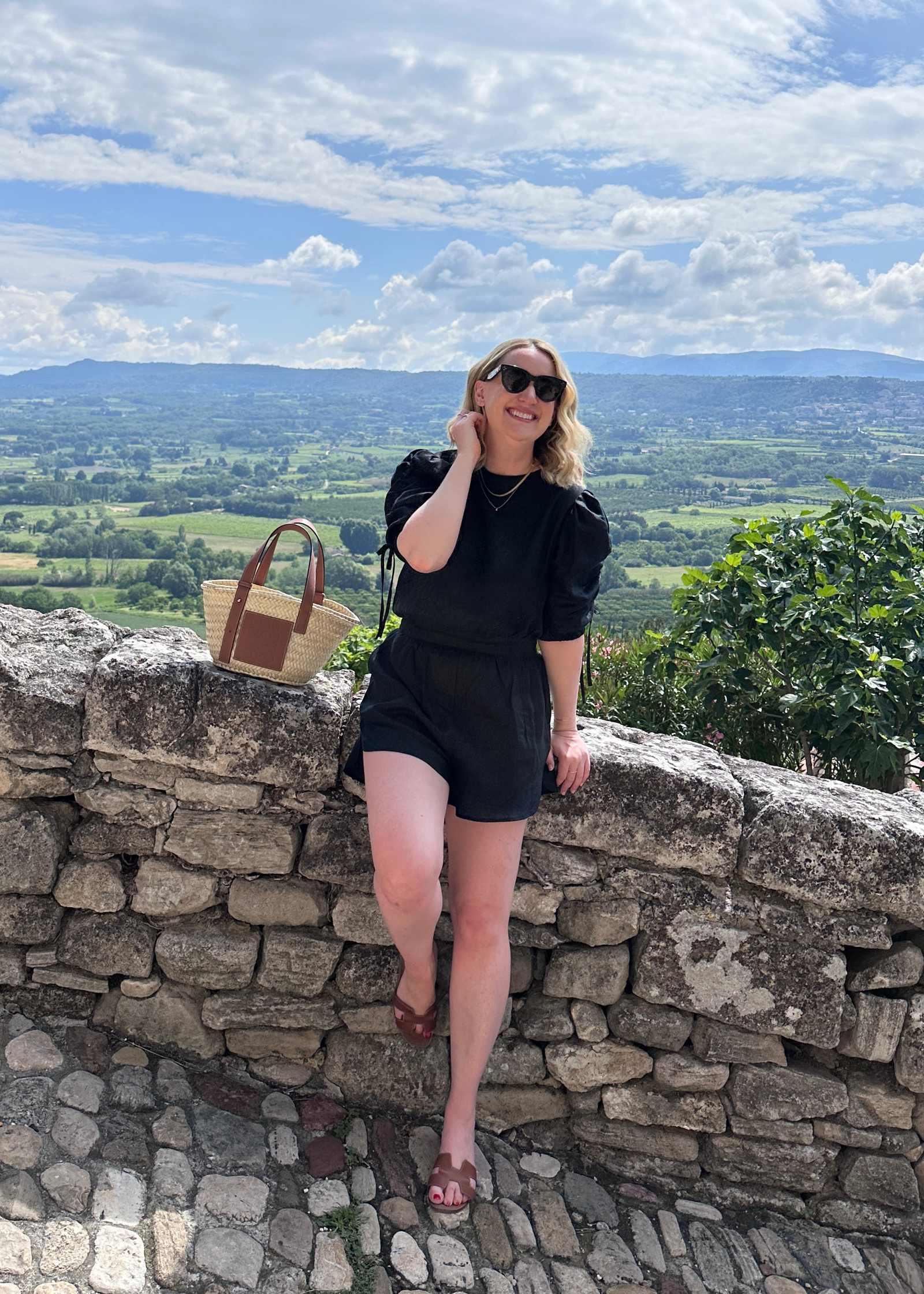 Wit Whimsy shares What to Pack for Europe in Summer - Meghan wearing Linen Romper in Provence and flat sandals