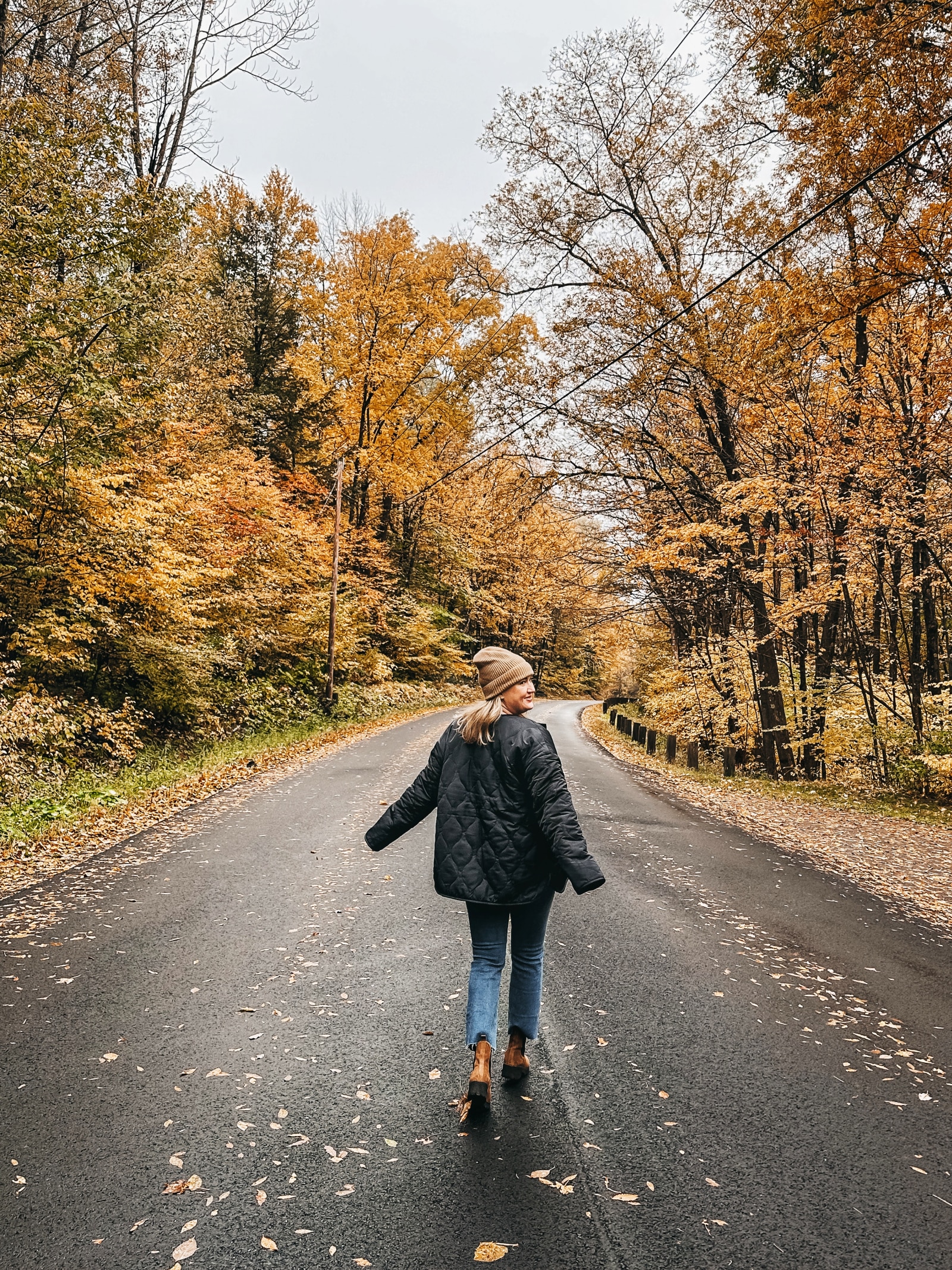 Winter Coats for Women Wit Whimsy wearing a black jacket and jeans