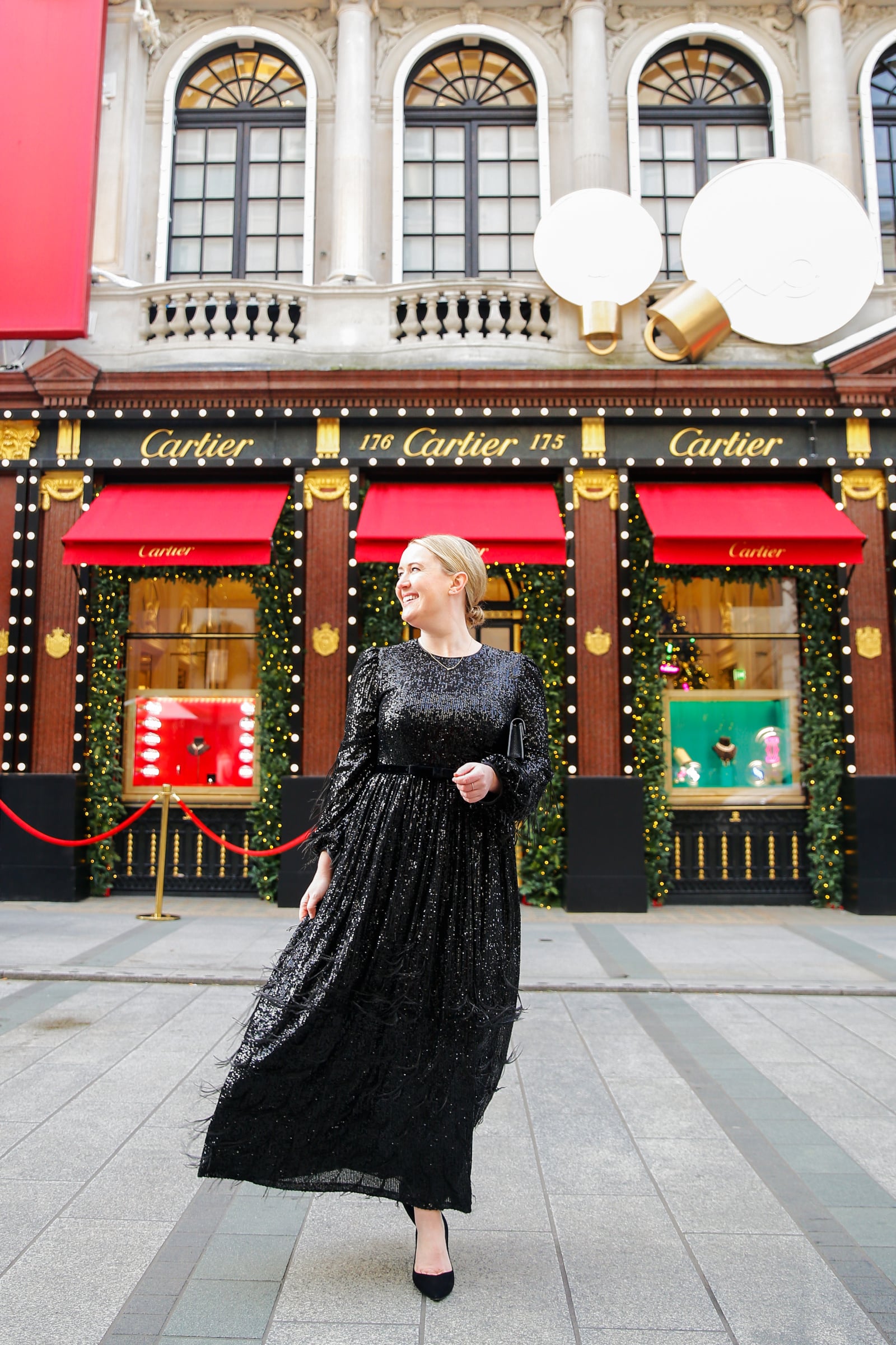 Whit Whimsy wearing a London Holiday Dress in front of Cartier