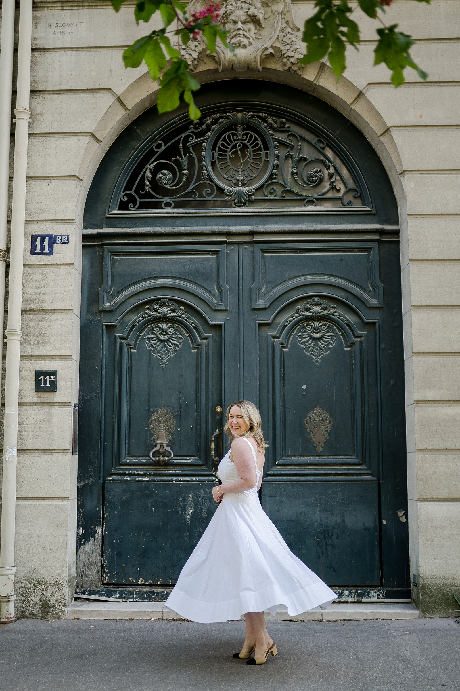 Meghan Donovan wearing a white dress in France