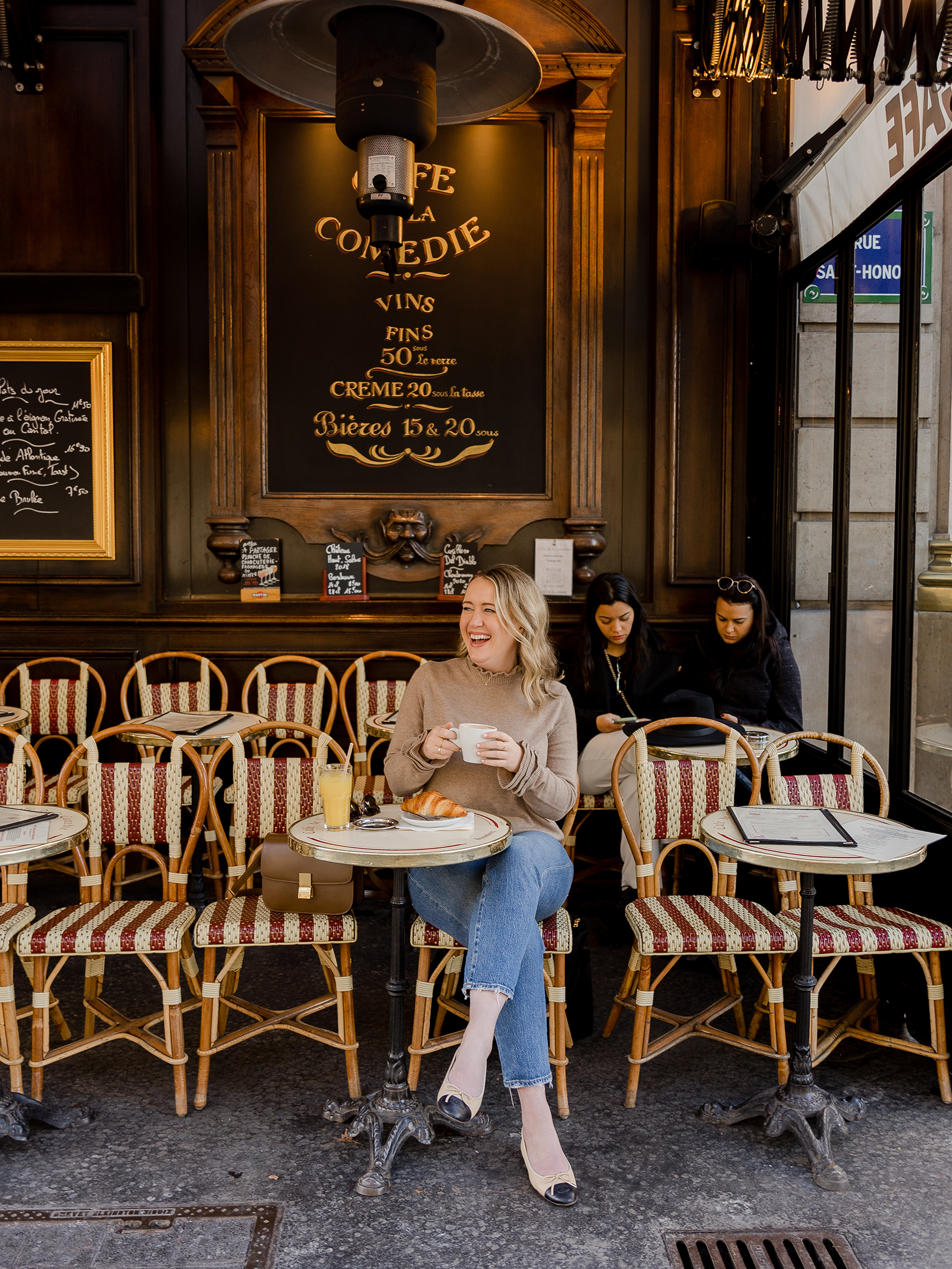 Meghan at a cafe in Paris