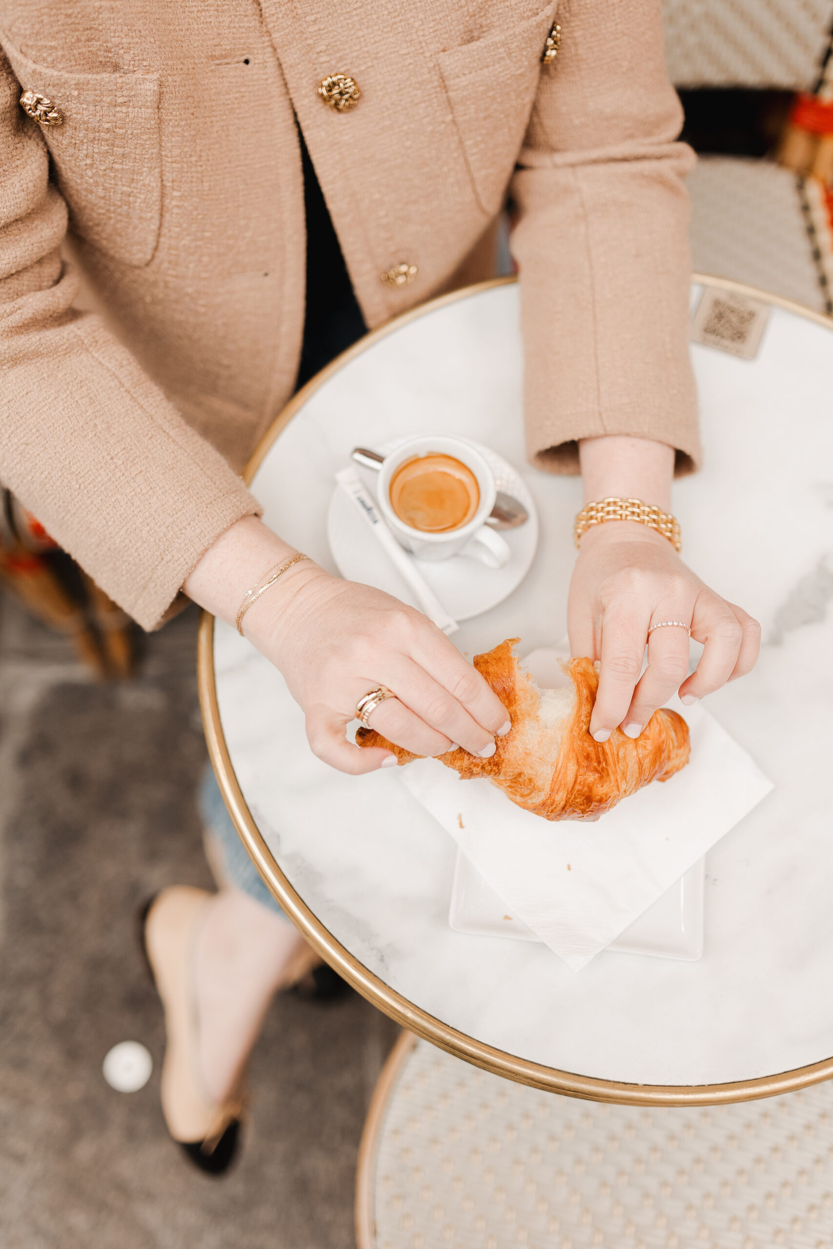 French Wardrobe Staples For Fall Croissants in Paris Cafe