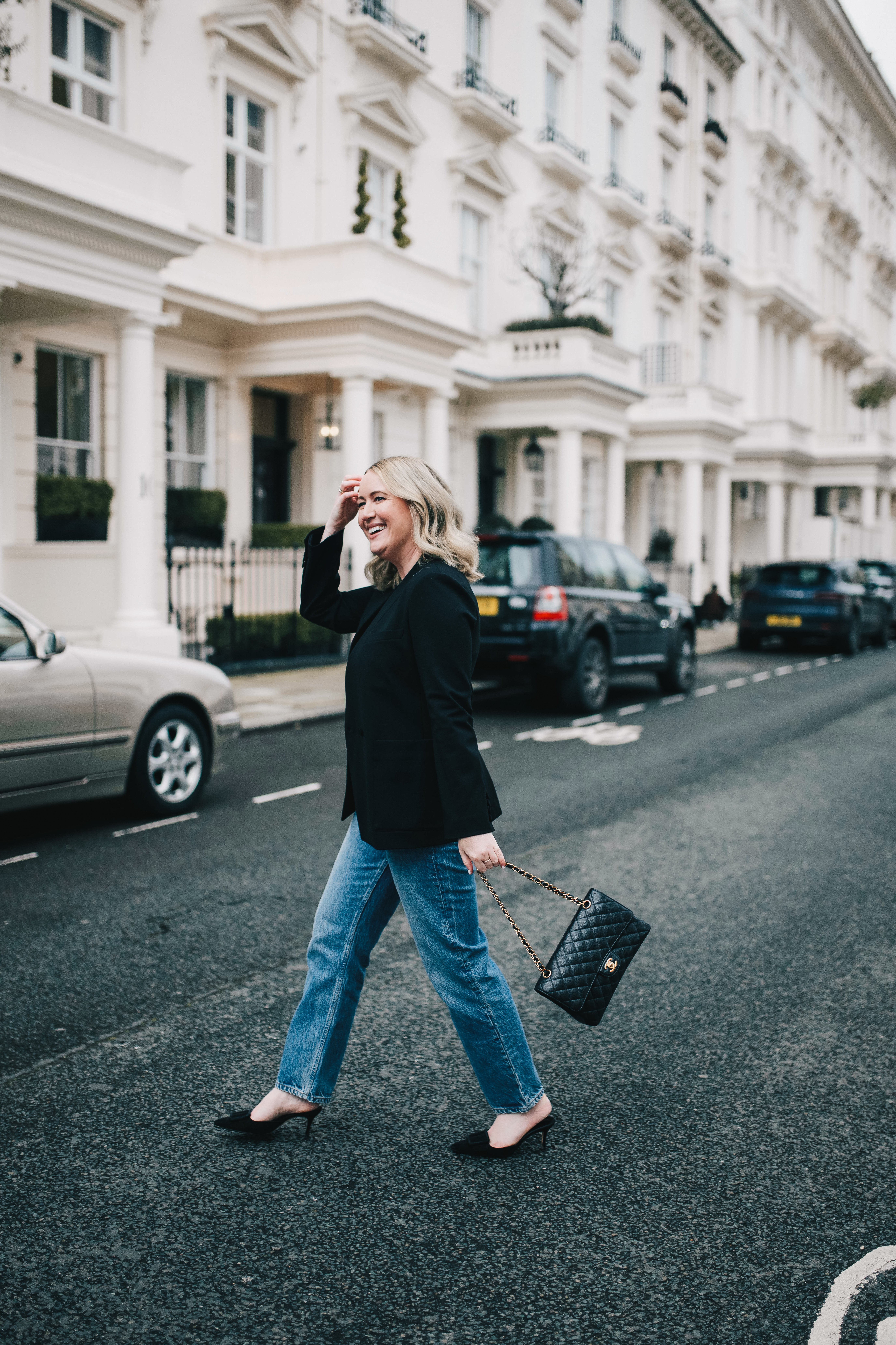 Capsule Wardrobe Basics wit & whimsy wearing a black blazer paired with straight-leg denim jeans | Capsule Wardrobe Basics