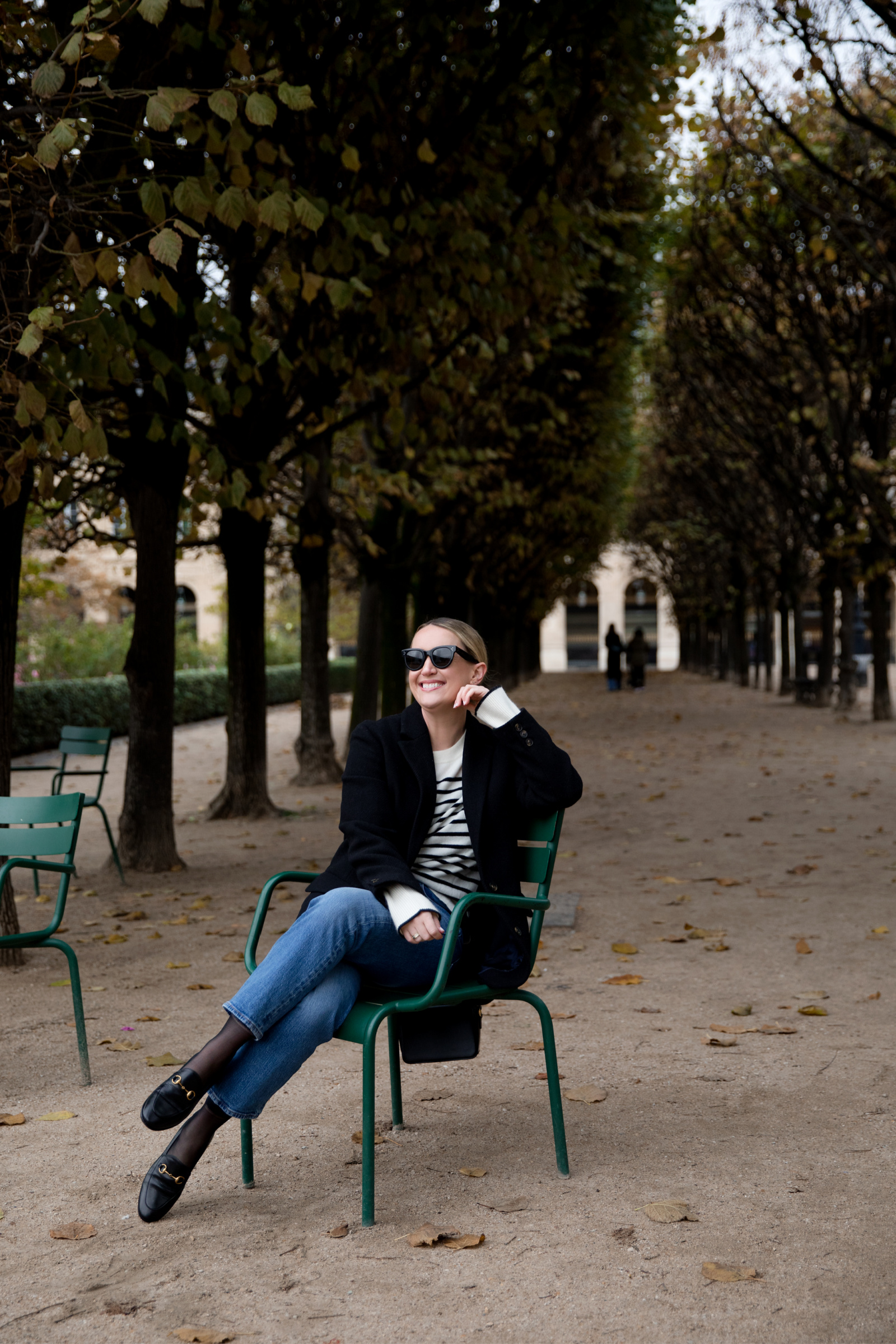 Fall Outfit Ideas with Jeans Paris Fall Outfit in the Palais Royal Gardens featuring Gucci loafers and a striped sweater by LaLigne and blazer