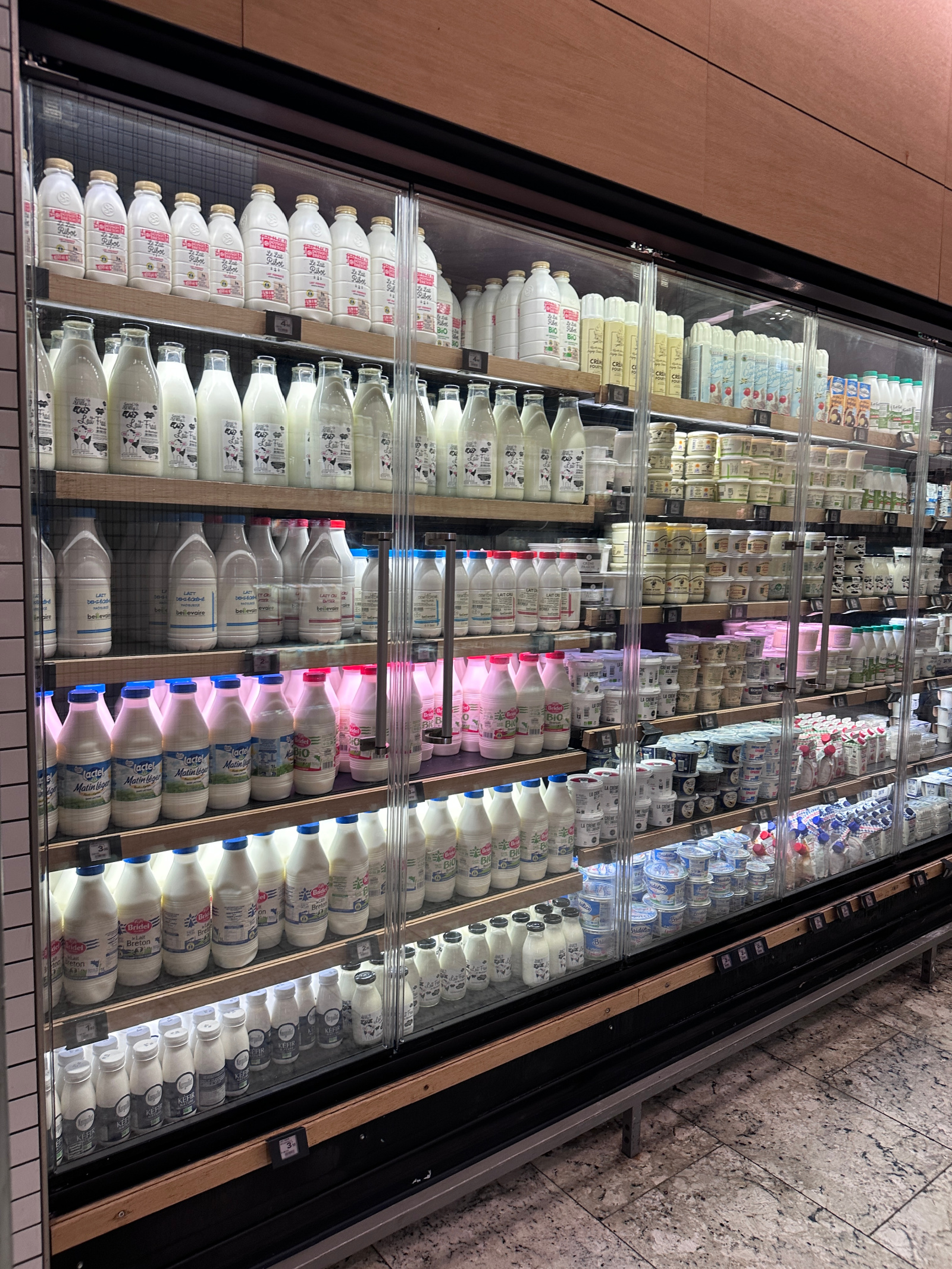 What to Buy at La Grande Épicerie Wit Whimsy Blogger Meghan Donovan shares What to Buy at La Grande Epicerie in Paris: in photo - a variety of milk in France