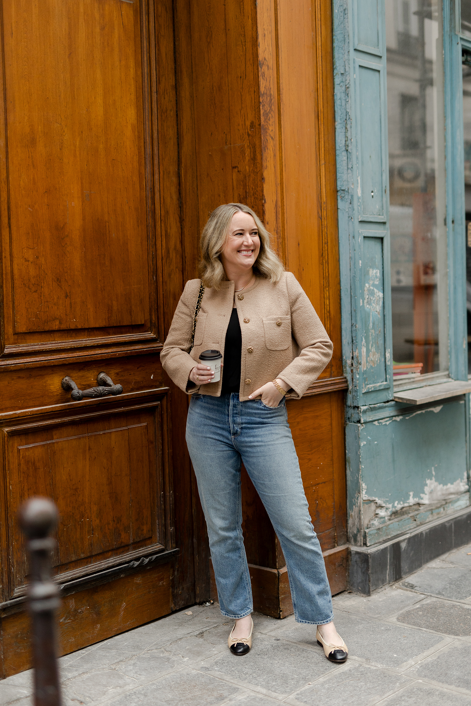  Wit Whimsy Blogger Meghan Donovan shares What to Wear in Paris in the Spring - in photo: Meghan wearing jeans and a tweed jacket in Paris