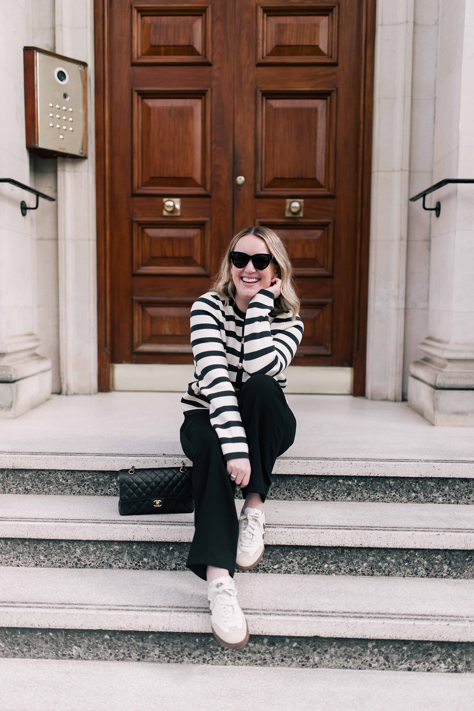 What to Wear in London Meghan wearing black and white striped top and black jeans