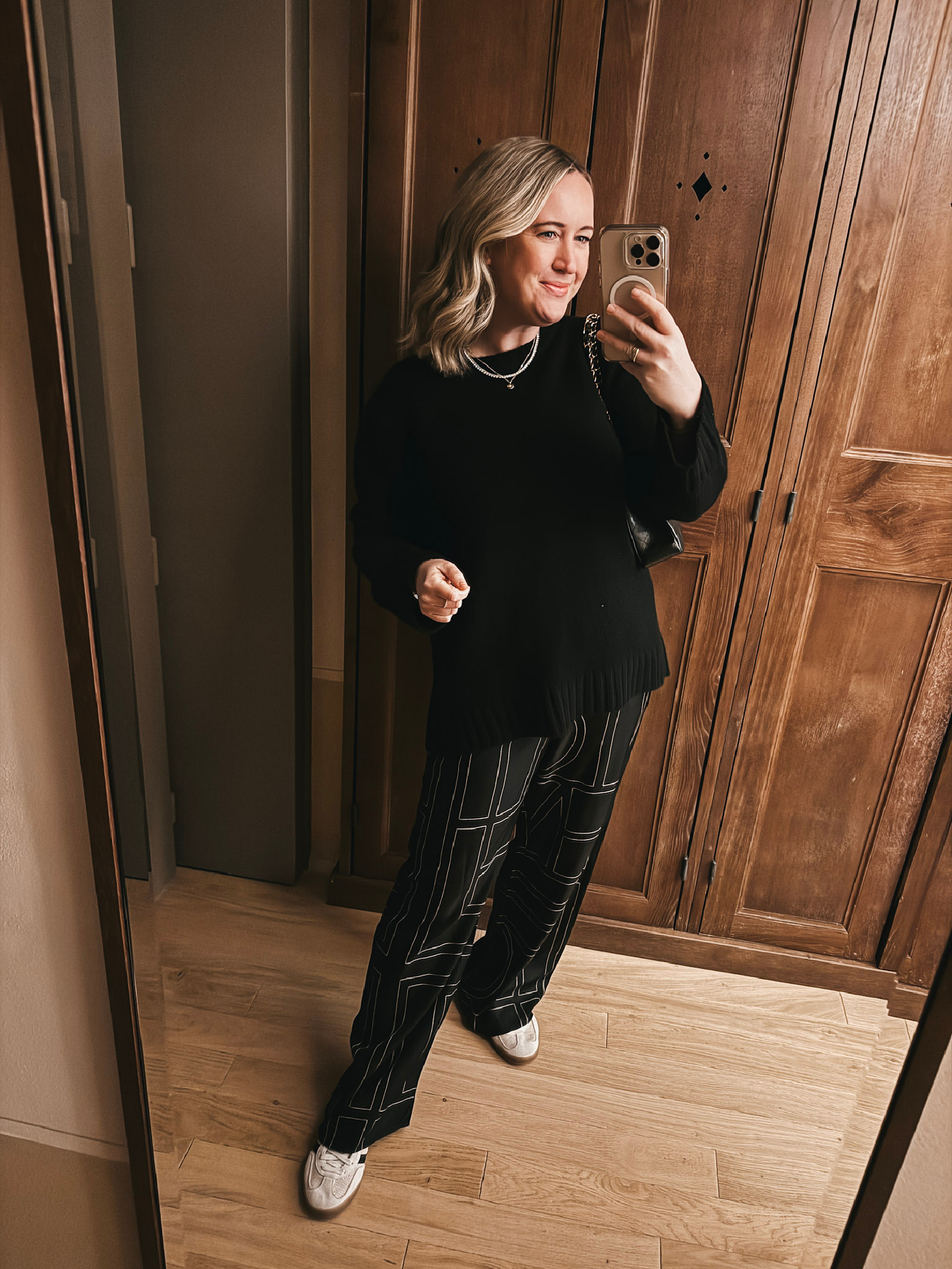 What to Wear on a Long Flight wit & whimsy wearing Toteme patterned silk pants