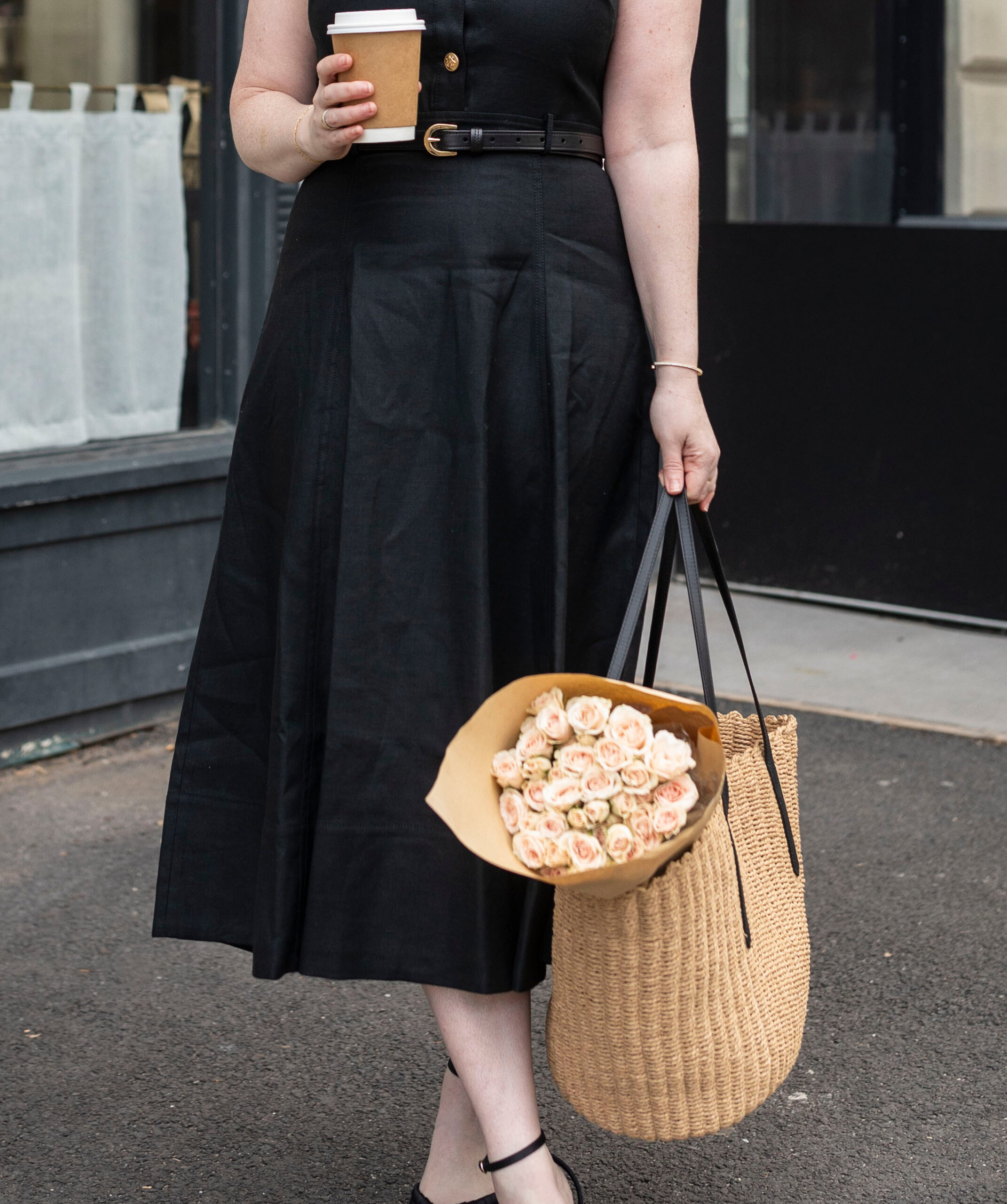 J Crew & Madewell Summer Favorites by Wit Whimsy - woman wearing black skirt and holding a bag with flowers
