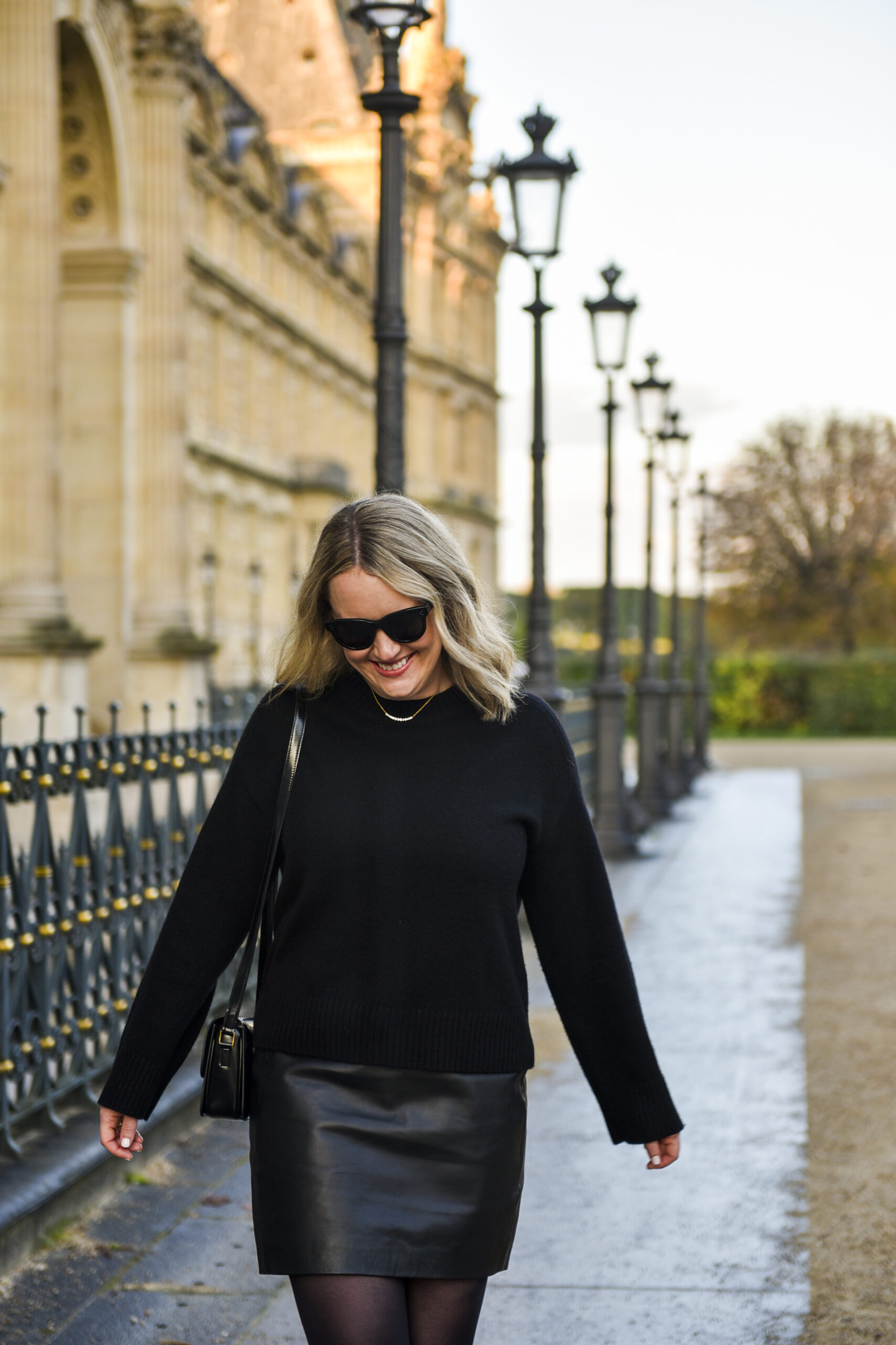  Wit Whimsy Blogger Meghan Donovan shares Dorsey Jewelry Review - woman wearing black sweater and leather skirt