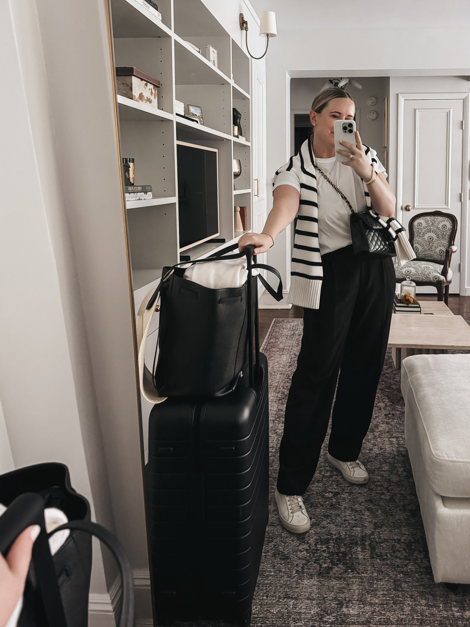 with & whimsy showing her travel packing essentials