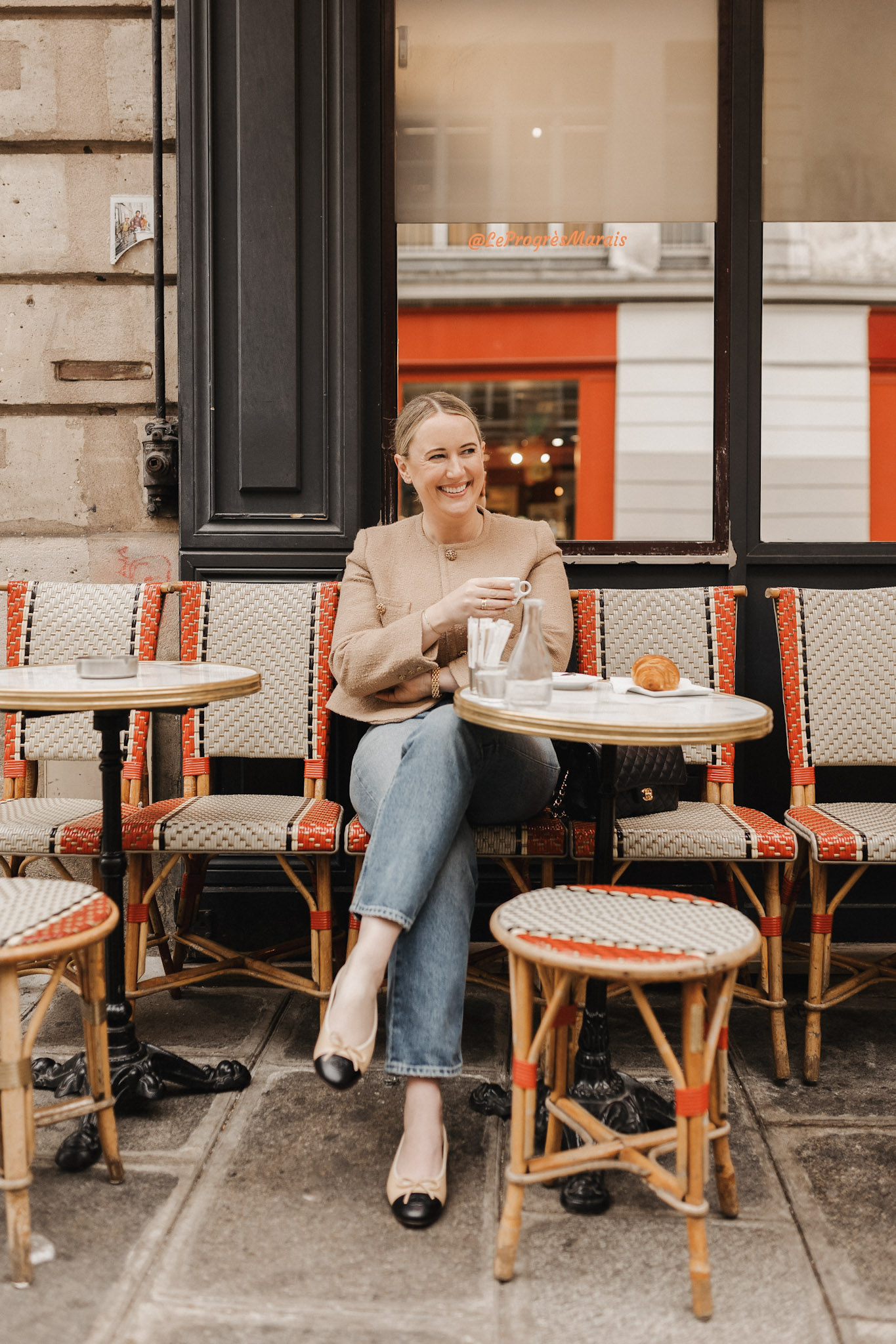 Best Coffee Shops in Paris wit & whimsy sitting at a cafe in Paris