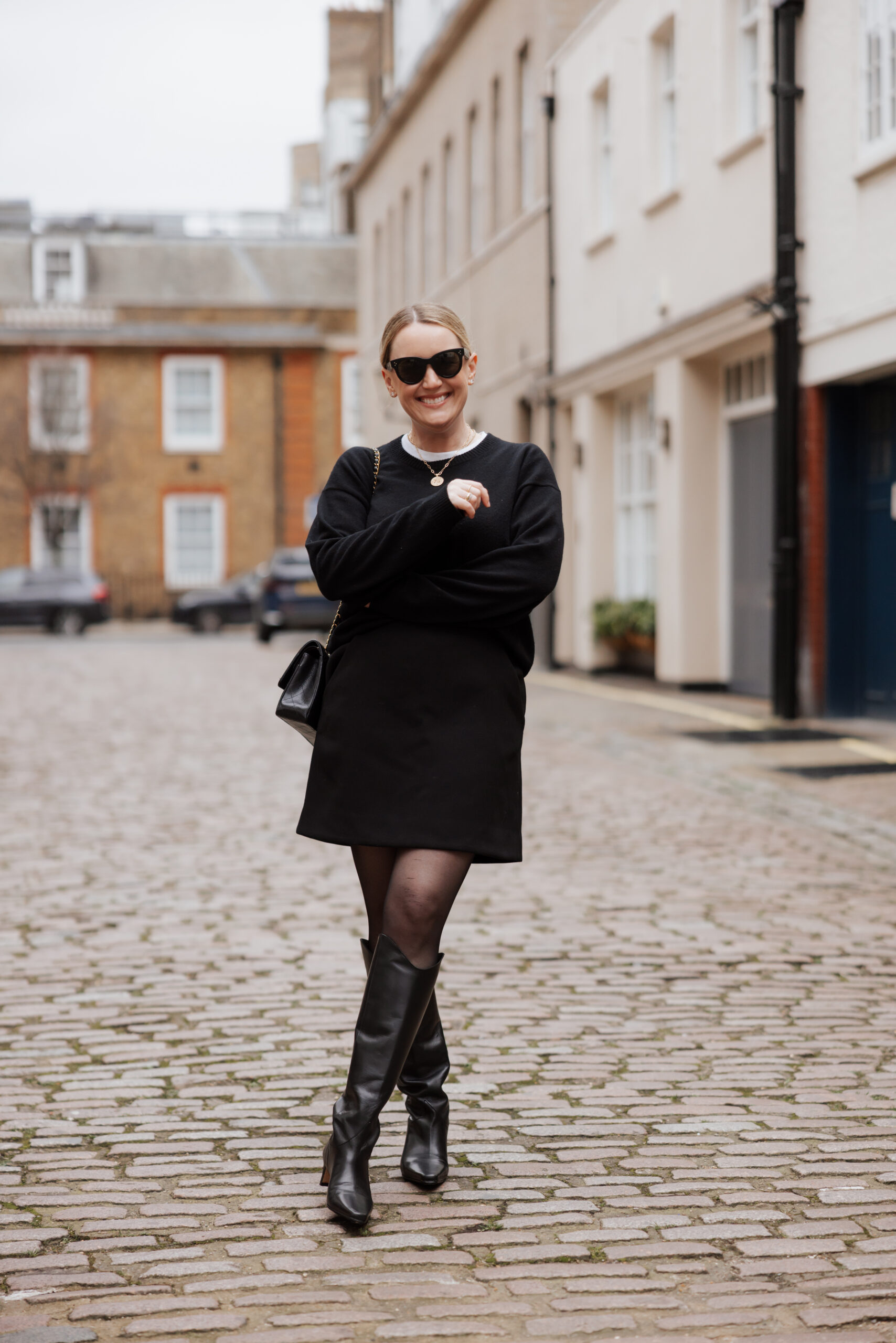 Sweater dress with tall boots